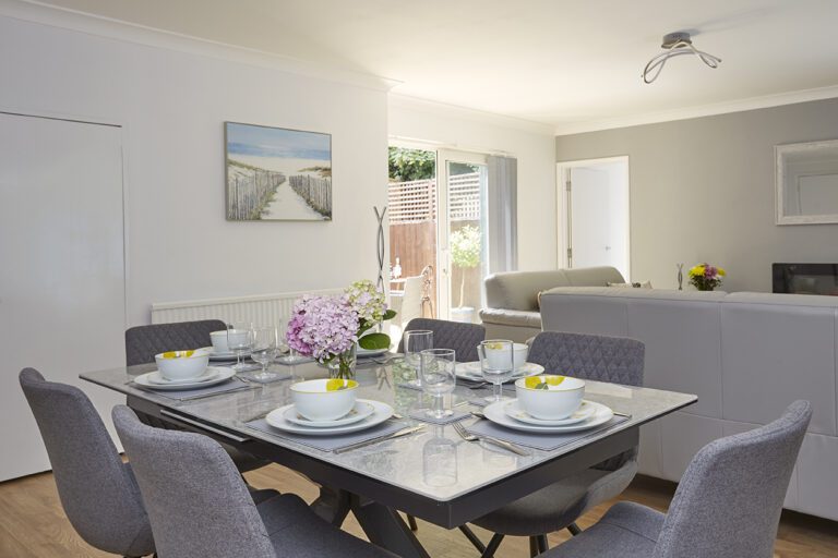 The Chine Court Apartment dining table laid for dinner