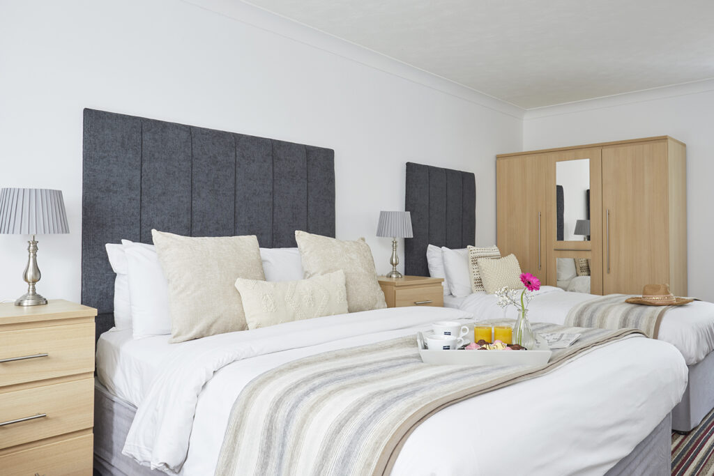 A Classic double room at Luccombe Manor with crisp white linen