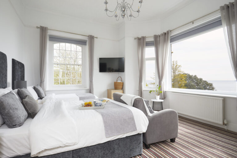 A Sea View Room with a double and a single bed