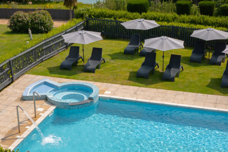 The outdoor pool and gardens at Luccombe Manor