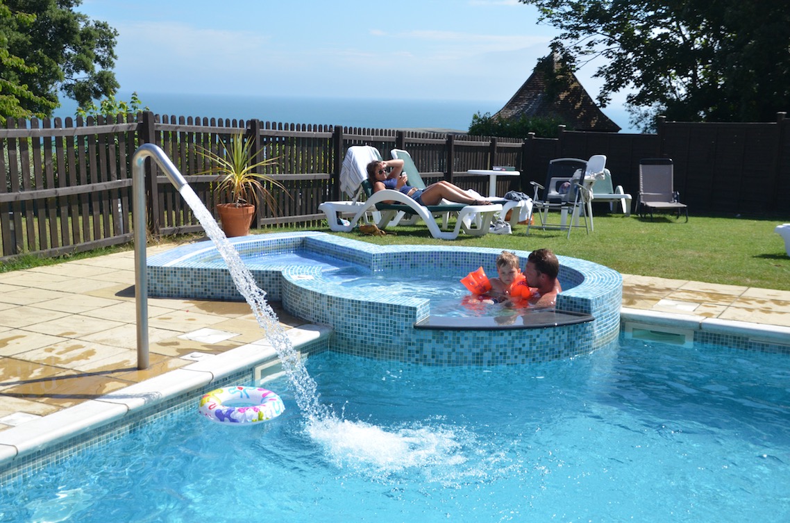 The outdoor pool with jets at Luccombe Manor